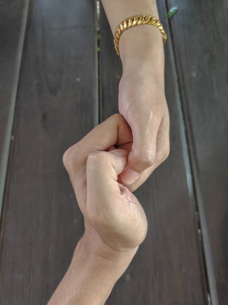 istock Male and female holding hand together 1283700907