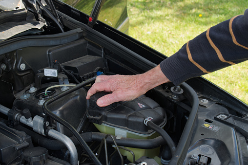 Before hitting the road, check if the windshield washer fluid tank is full