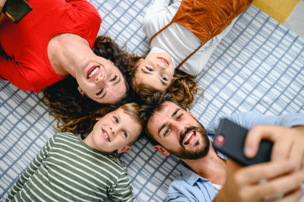 istock Cheerful family making selfie 1283701217
