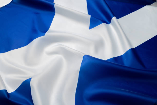 istock Rippled flag of Scotland lying on white surface 1283701660