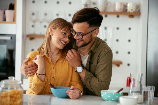 istock Young couple eating breakfast at home. 1283701768
