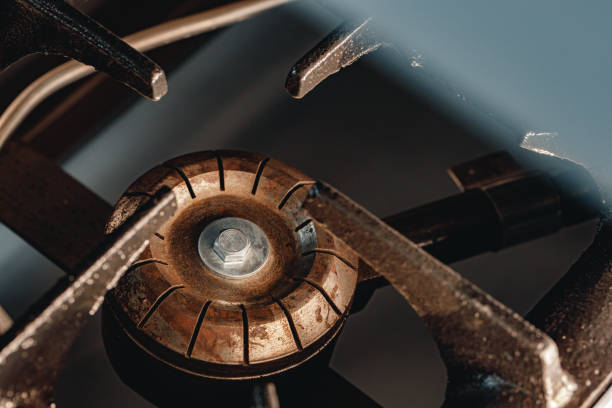 istock Dirty old gas stove burner ring close up 1283701801