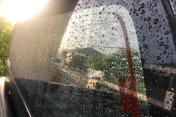 istock Water droplets on the car glass with soft light 1283702483
