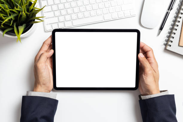 istock Mockup image tablet, businessman hand holding tablet pc with blank white screen 1283704898