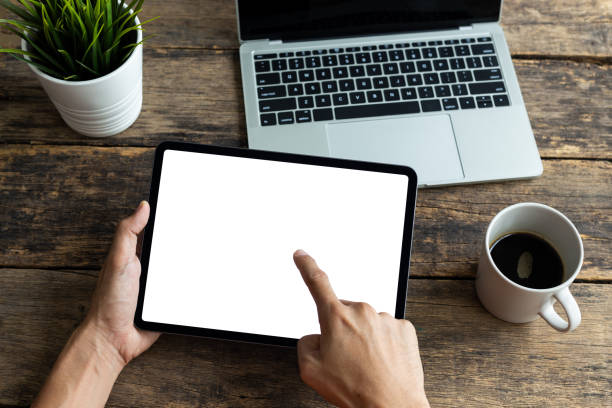 istock Mockup image tablet, man hand holding tablet pc with blank white screen 1283704918