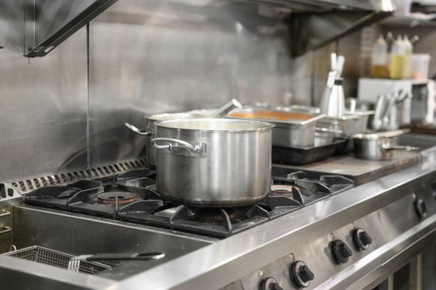 istock Stainless steel restaurant professional kitchen equipment and work surface. High quality photo 1283705747