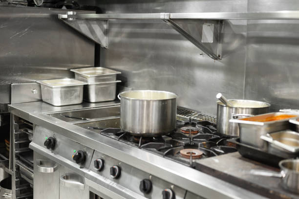 istock Stainless steel restaurant professional kitchen equipment and work surface. High quality photo 1283705764