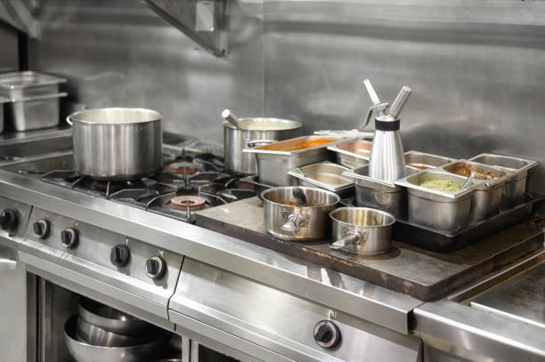 istock Stainless steel restaurant professional kitchen equipment and work surface. High quality photo 1283705792