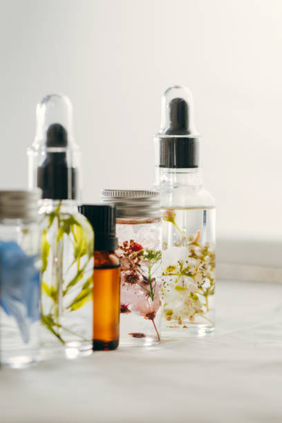 istock Transparent Bottles of essential oil with fresh herbs. 1283706122