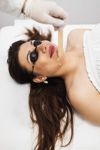 istock Woman receiving epilation treatment 1283706218