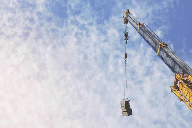 istock Yellow Telescopic Arm of a Mobile Crane Operating at a Construction Site 1283706367