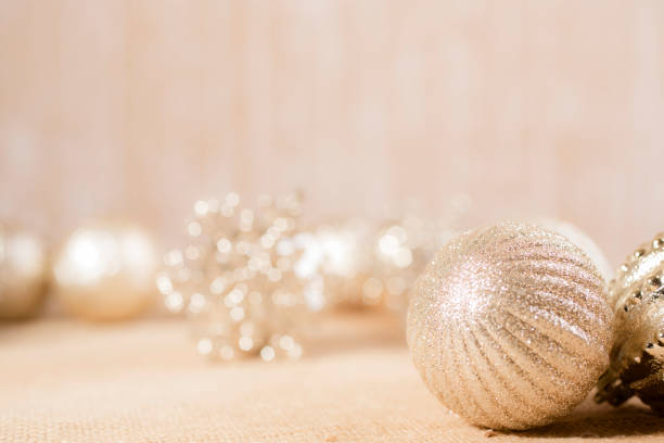 istock Ecru toned image of silver/gold Christmas ornaments. 1283708673