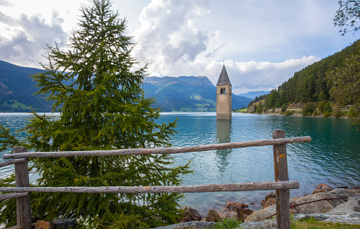 The bell tower of the sunken church in Curon, Resia Lake, Bolzano province, South Tyrol, Italy.