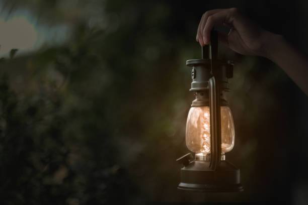 istock Tourists holding lanterns to light up  in camping 1283709994