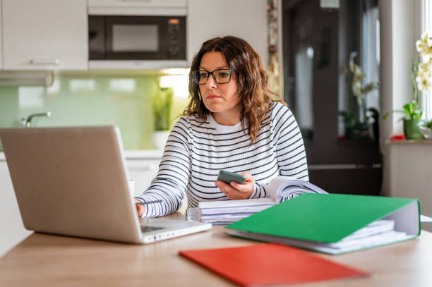 istock Adult woman working from home 1283711546