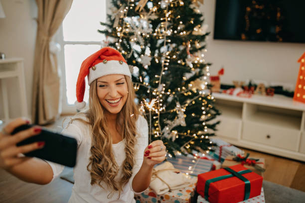 istock Young woman packing presents for Christmas 1283711756