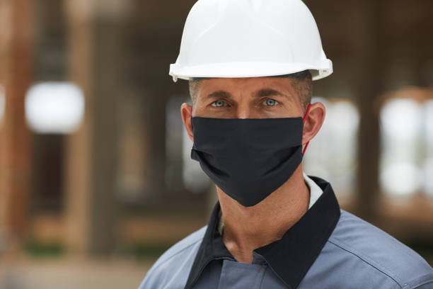 istock Male Worker Wearing Mask 1283713631