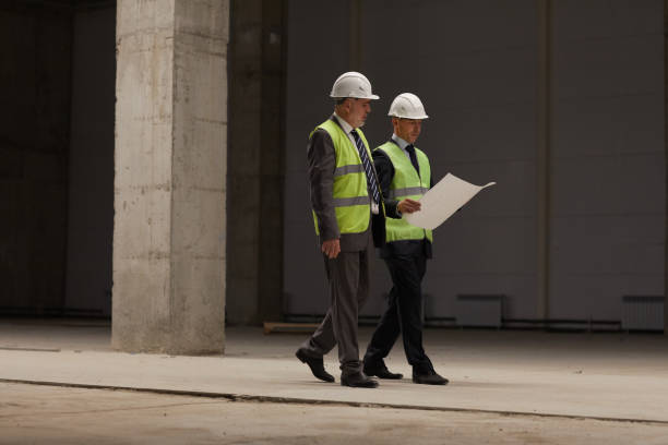 istock Business People Discussing Investment at Construction Site 1283713656