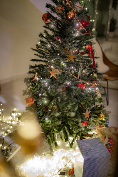 istock Christmas tree decoration and present at home getting ready for Christmas celebration 1283714825