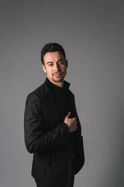 istock Studio portrait of a young man in a black blazer against plain studio background 1283716274