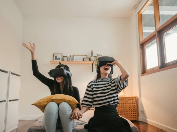 istock Young friends using VR together at home. 1283716334