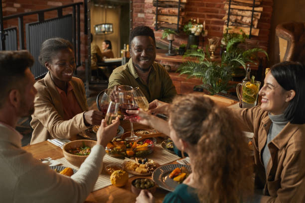 istock Group of Friends Toasting at Dinner Party 1283716734