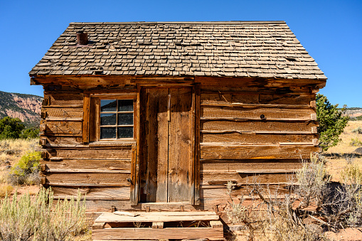 Old log cabin of the wild west in the Yellowstone Ecosystem, western USA, North America. Nearest cities are Jackson, Wyoming, Denver, Colorado and Salt Lake City, Utah.
