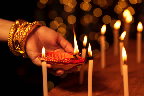 istock Woman Celebrating Diwali Night 1283718225