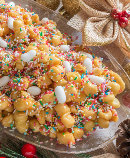 istock Neapolitan pastry called struffoli - Little shortcrust pastry balls fried dipped in honey 1283718321