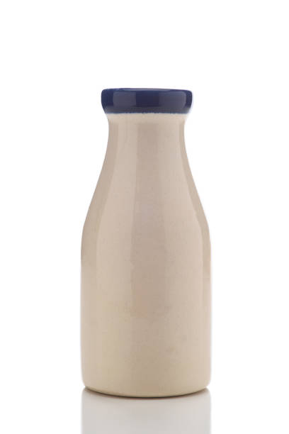 istock A creamic milk bottle isolated on white. 1283720864