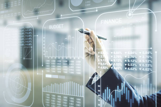 istock Man hand with pen working with abstract virtual stats data hologram on blurred office background. Multiexposure 1283720953