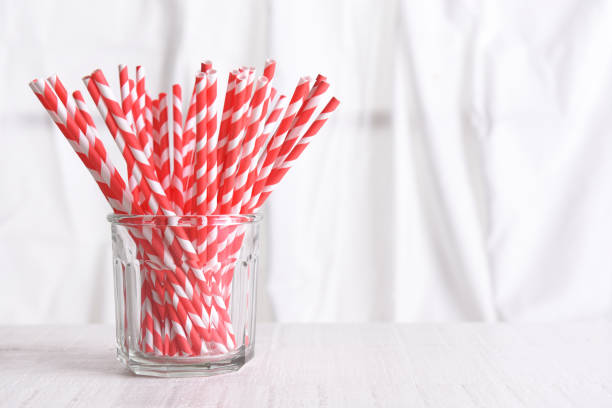 istock Recyclable Red Drinking Straws in a glass 1283721190