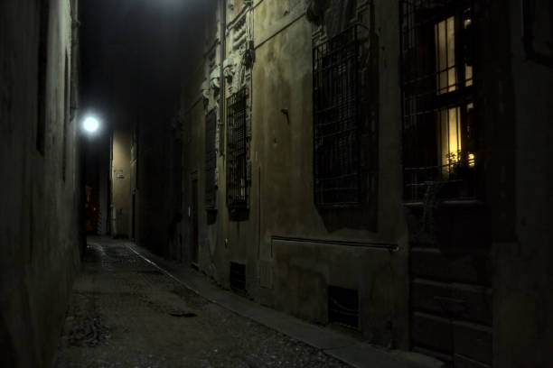 istock Alley in an italian town during a light rainfall at night 1283721307