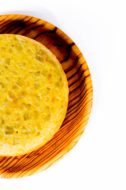 istock Spanish omelette on a wooden tray on white background 1283724567