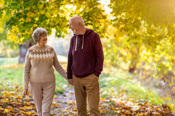 istock Happy senior couple enjoying a day outdoors in autumn 1283724733