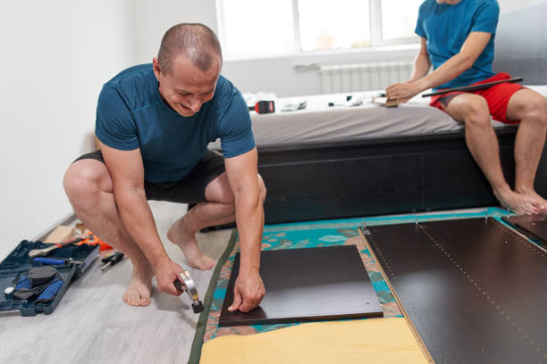 istock Father and son assembling furniture in new home 1283725681