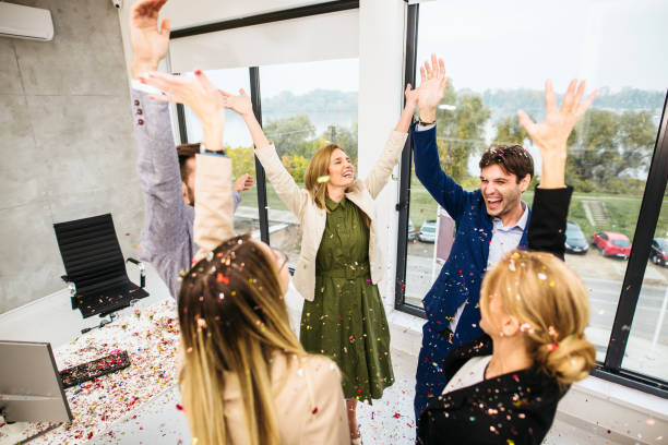 istock Business people celebrating inside modern office 1283726349