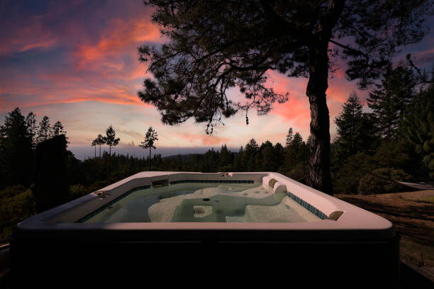 Hot tub at sunset by ocean in forest in Northern California Hot tub at sunset by ocean in forest in Northern California mendocino photos stock pictures, royalty-free photos & images