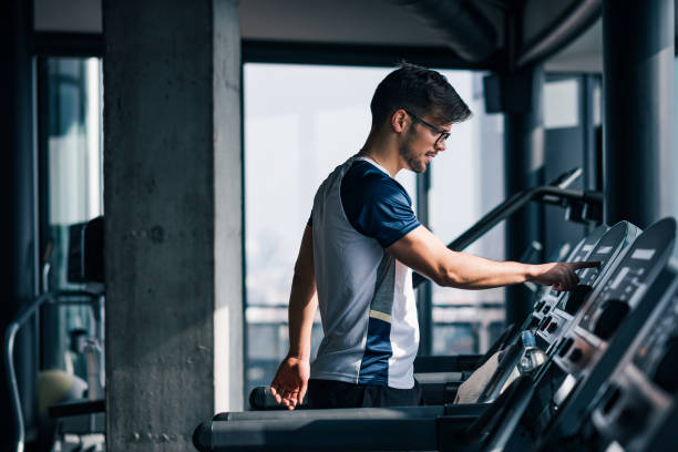 istock Young athlete training on a treadmill in the morning. 1283729058