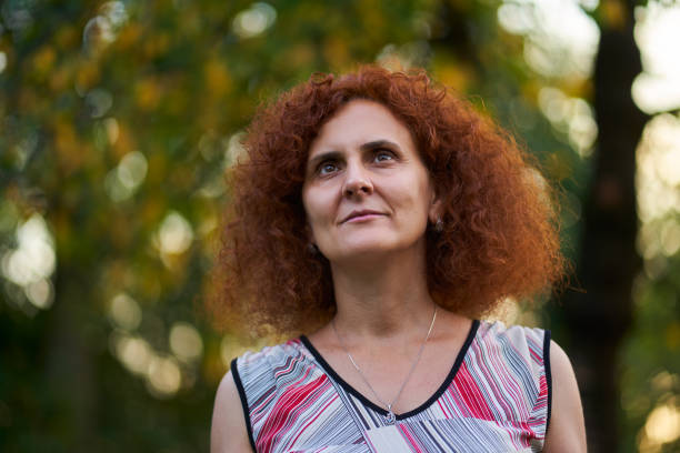 istock Curly redhead in the countryside 1283729214