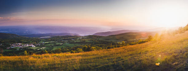 panorama landscape of beautiful french village of innimond in middle of bugey alps mountains at sunset - france european alps landscape meadow imagens e fotografias de stock