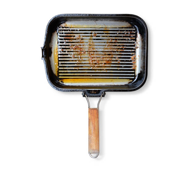 Greasy grill pan on white background stock photo