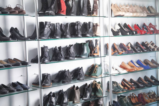 istock Elegant leather female boots in the store. 1283735152
