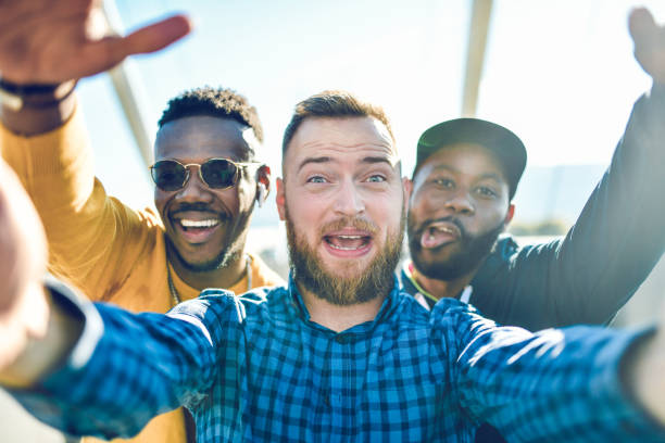 istock Funny Multi Ethnic Selfie By Smiling Friends 1283735179