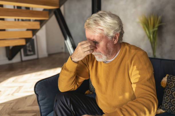 istock Elderly man experiencing stress, suffers from headache 1283735910
