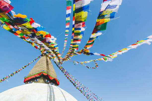 istock Nepali Stupa with colorful prayer flags and blue sky, in Nepal 1283736067