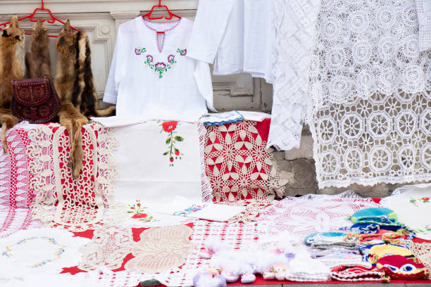 Hand craft crochet doilies with different patterns and lace mat items with floral ornaments on street sale display, detail