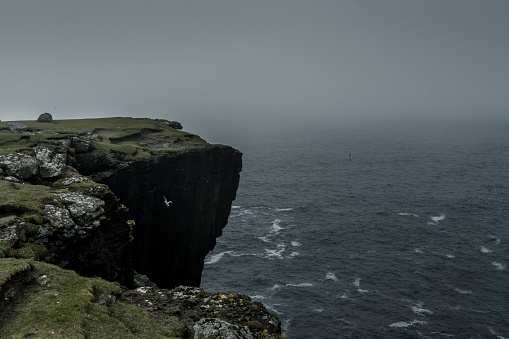 Eshaness cliffs on a foogy autumn day on the west coast of Northmavine on the island of Mainland, Shetland.