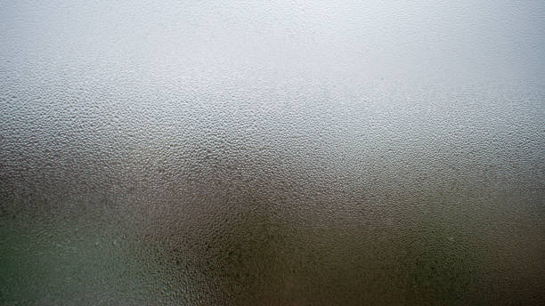 istock Raindrops on the window close up. rain drops on the glass macro. water drops falling down on window. rainy day. 1283736749
