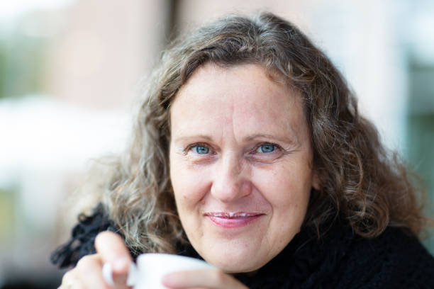 istock Mature woman drinking coffee 1283740827
